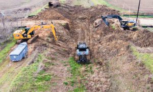 Excavating old culvert to install a new one